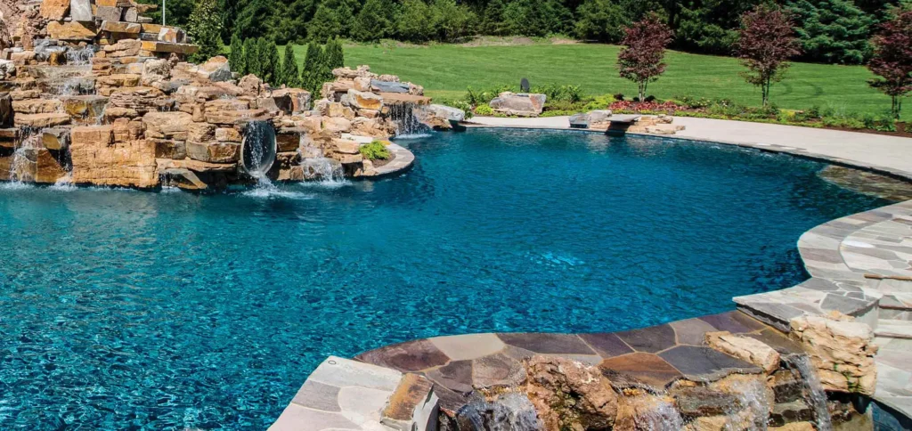 a freeform pool with waterfalls