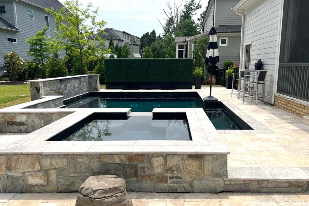 a concrete pool and spa