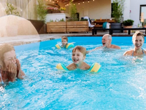 a family playing in the pool