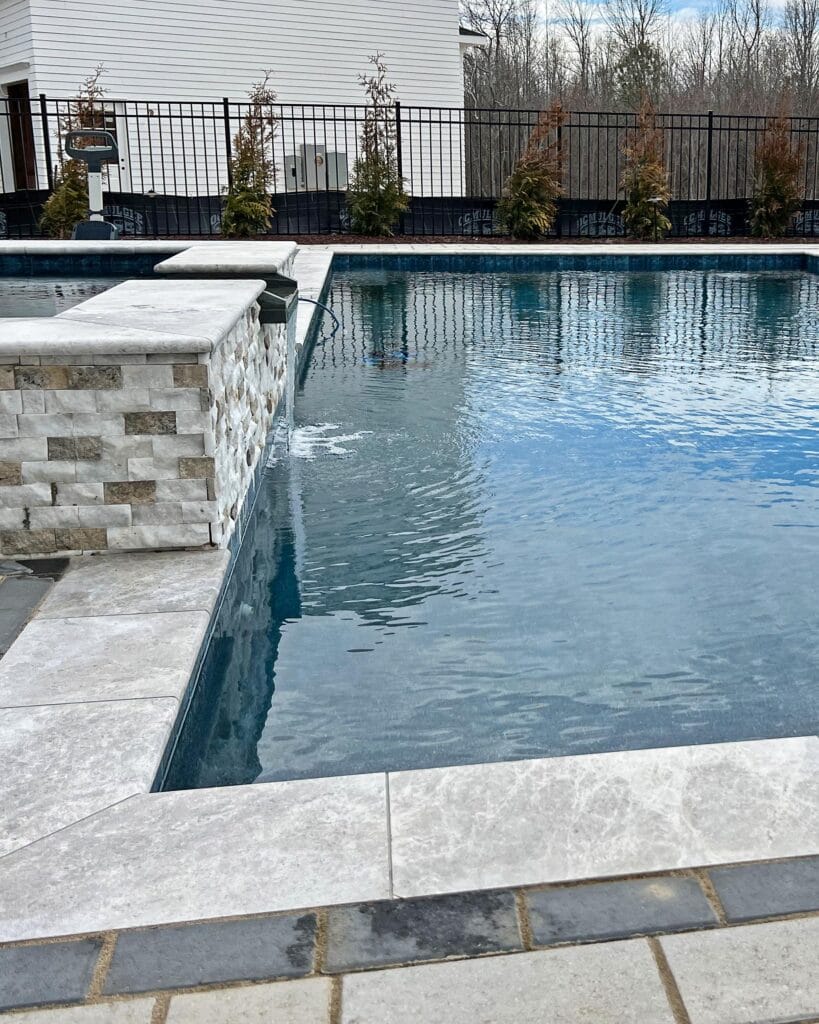 a pool with a water feature